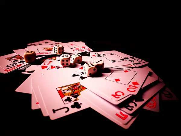 depositphotos_452672766-stock-photo-dice-playing-cards-black-background.jpg